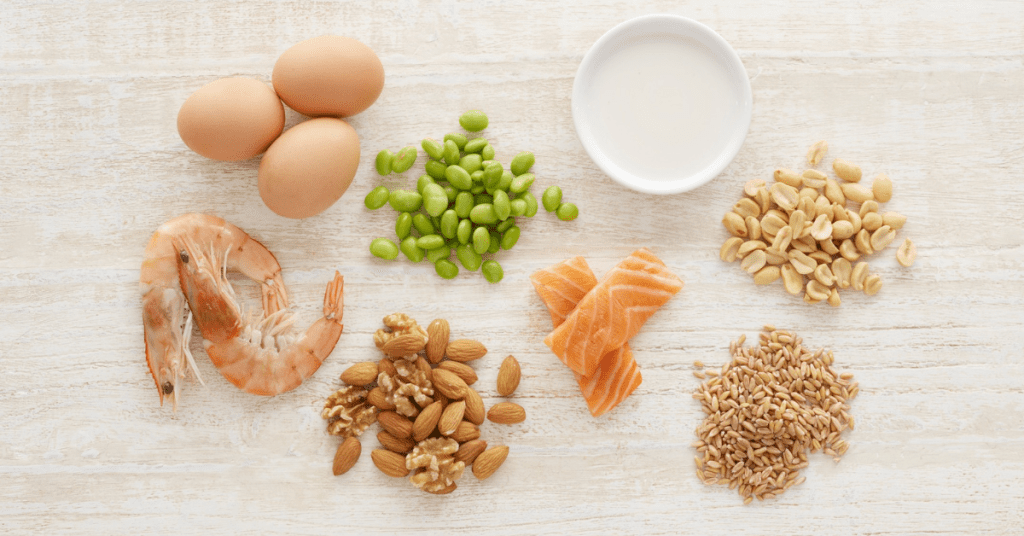 eggs, seafood, nuts and milk spread out on a table